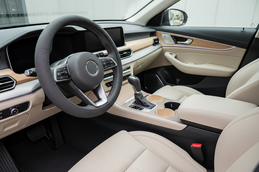 Modern car interior with coordinated steering wheel cover, gear shift cover, cup holder inserts, armrest cushion, and subtle dashboard accents. Clean realistic ecommerce blog thumbnail, no people, no text, no logo.