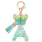 JINGUAZI Initial letter Keychains for Women Tassel Butterfly Pink Purple Cute Car Keychain for Wallet Backpack bag charm - color: A-green