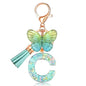 JINGUAZI Initial letter Keychains for Women Tassel Butterfly Pink Purple Cute Car Keychain for Wallet Backpack bag charm - color: C-green