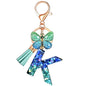 JINGUAZI Initial letter Keychains for Women Tassel Butterfly Pink Purple Cute Car Keychain for Wallet Backpack bag charm - color: K-blue Green