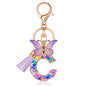 JINGUAZI Initial letter Keychains for Women Tassel Butterfly Pink Purple Cute Car Keychain for Wallet Backpack bag charm - color: C-purple