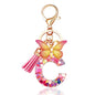 JINGUAZI Initial letter Keychains for Women Tassel Butterfly Pink Purple Cute Car Keychain for Wallet Backpack bag charm - color: C-pink