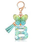 JINGUAZI Initial letter Keychains for Women Tassel Butterfly Pink Purple Cute Car Keychain for Wallet Backpack bag charm - color: B-green