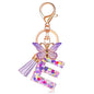 JINGUAZI Initial letter Keychains for Women Tassel Butterfly Pink Purple Cute Car Keychain for Wallet Backpack bag charm - color: E-purple