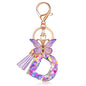 JINGUAZI Initial letter Keychains for Women Tassel Butterfly Pink Purple Cute Car Keychain for Wallet Backpack bag charm - color: D-purple