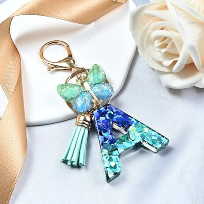 JINGUAZI Initial letter Keychains for Women Tassel Butterfly Pink Purple Cute Car Keychain for Wallet Backpack bag charm - color: A-blue Green